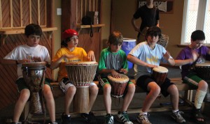 Campers drumming inside